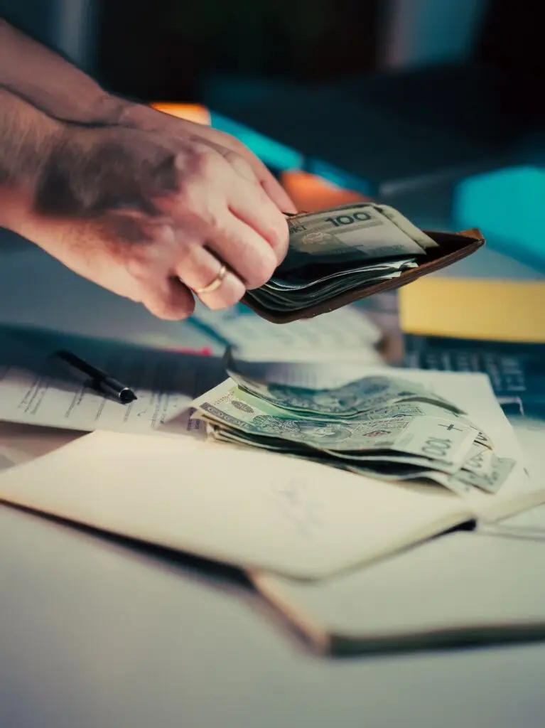 Person pulling money from wallet